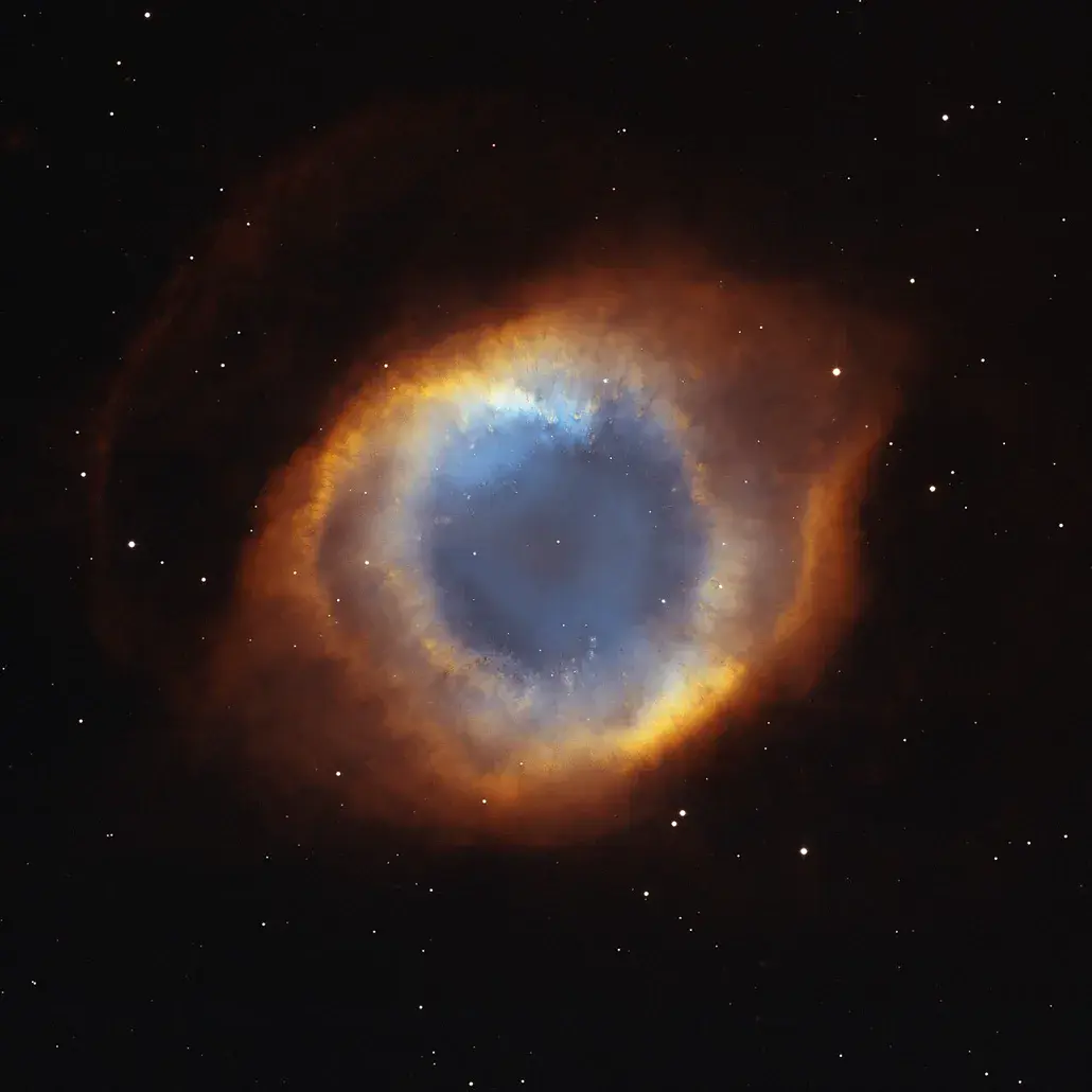 The Helix Nebula, a planetary nebula shaped like a vast glowing eye, imaged by Hubble and other telescopes