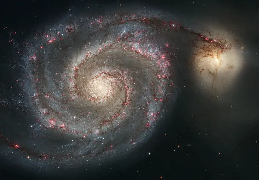 The Whirlpool Galaxy M51, a face-on spiral with a companion galaxy at the end of one arm